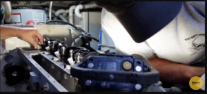 Technician install a injector on a Cummins 6CTA