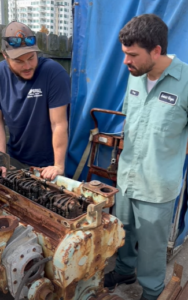 http://Dion from Imperial Diesel Service, LLC and Anthony Cooley from Godwin Singer Machine shop look at a core Detroit Diesel 4-71 (2-Valve)engine.